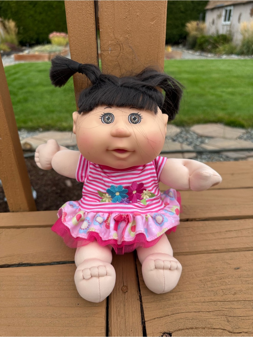 Plush Baby Doll in Pink Floral Stripe Dress with Black Hair
